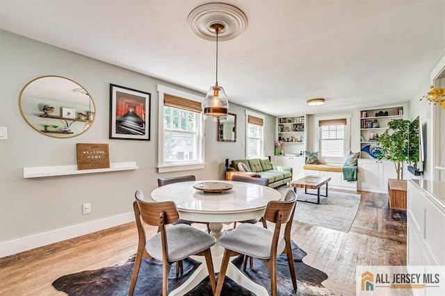 121 E Cliff Rd, Colonia, NJ 07067 - dining room featuring wood finished floors and built in shelves