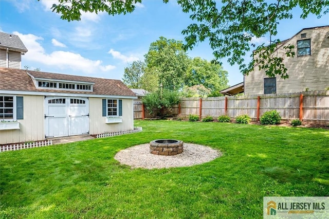 121 E Cliff Rd, Colonia, NJ 07067 - fenced backyard with an outdoor fire pit and an outdoor structure