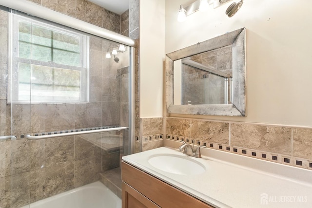 68 Pennsylvania Ave, Perth Amboy, NJ 08861 - bathroom with vanity, shower / bath combination with glass door, tile walls, and a wainscoted wall