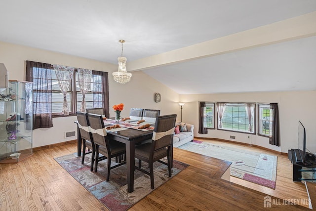 1208 Omaha Rd, North Brunswick, NJ 08902 - dining area with a chandelier and light wood-style flooring
