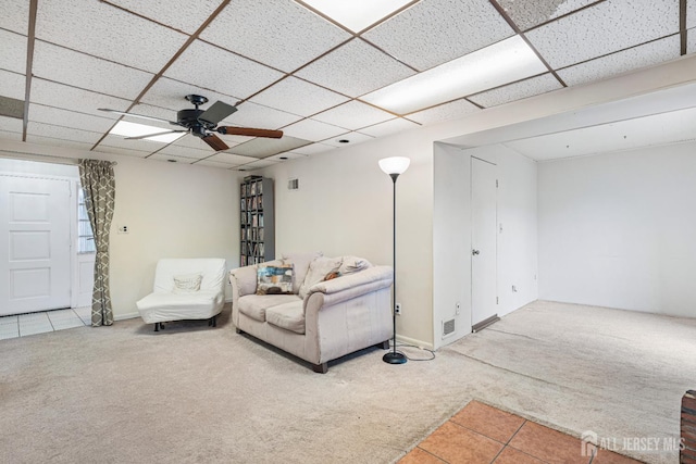 1208 Omaha Rd, North Brunswick, NJ 08902 - living room with carpet, a ceiling fan, tile patterned flooring, and a drop ceiling