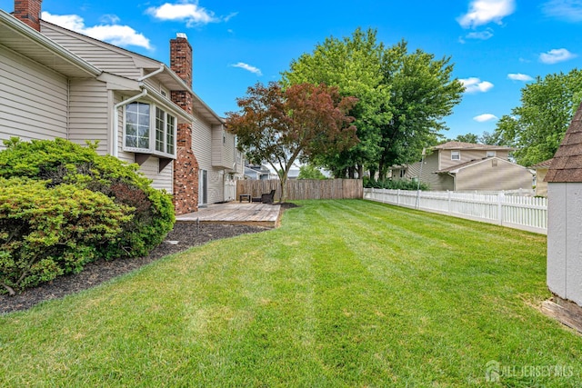 1208 Omaha Rd, North Brunswick, NJ 08902 - view of yard with a wooden deck