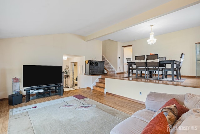 1208 Omaha Rd, North Brunswick, NJ 08902 - living room with wood finished floors, stairs, and a chandelier