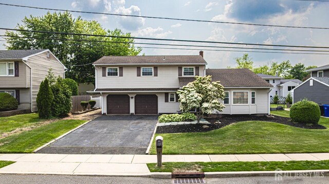 1208 Omaha Rd, North Brunswick, NJ 08902 - view of front of home with driveway and a garage