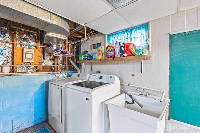 1208 Omaha Rd, North Brunswick, NJ 08902 - laundry area featuring separate washer and dryer and concrete block wall