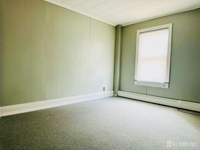 unfurnished room featuring baseboard heating, carpet, and a healthy amount of sunlight