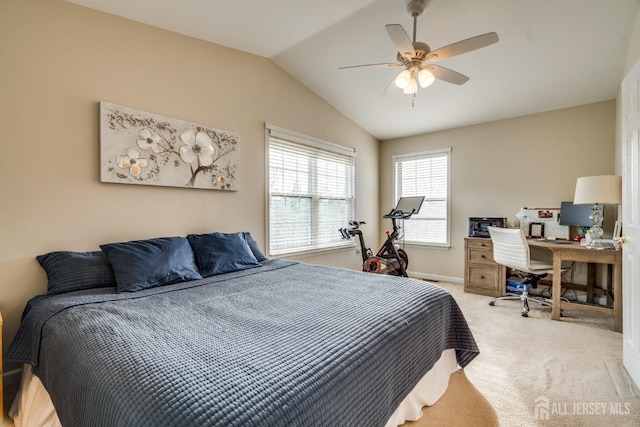 carpeted bedroom with vaulted ceiling and ceiling fan