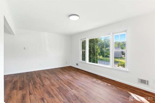1682 Taylor Dr, North Brunswick, NJ 08902 - unfurnished room featuring dark wood-type flooring and baseboards