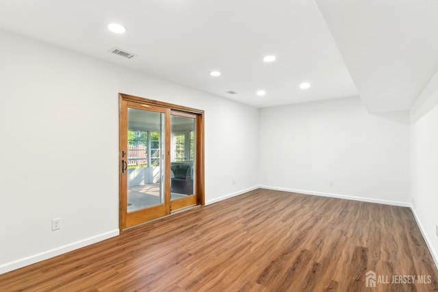 1682 Taylor Dr, North Brunswick, NJ 08902 - spare room with wood finished floors and recessed lighting
