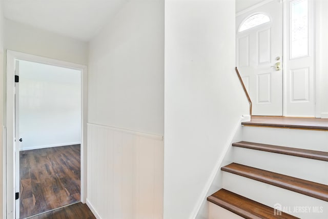 1682 Taylor Dr, North Brunswick, NJ 08902 - stairs with wood finished floors and wainscoting