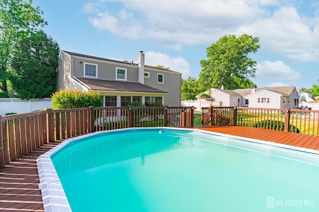 1682 Taylor Dr, North Brunswick, NJ 08902 - view of pool featuring a deck and a fenced backyard