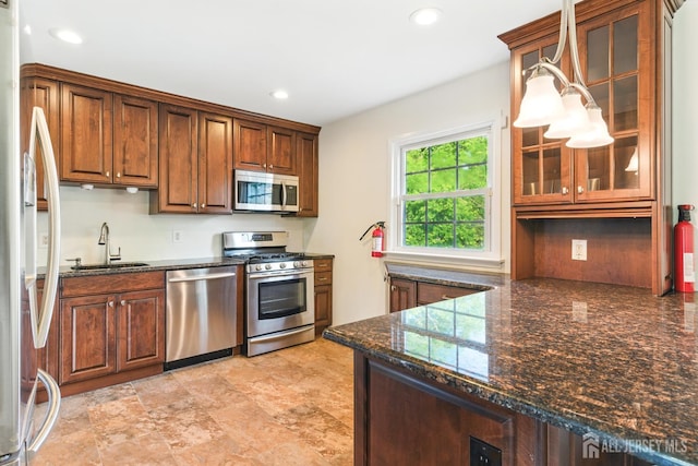 1682 Taylor Dr, North Brunswick, NJ 08902 - kitchen with stainless steel appliances, recessed lighting, glass insert cabinets, and dark stone countertops