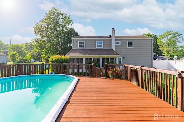 1682 Taylor Dr, North Brunswick, NJ 08902 - view of swimming pool with a wooden deck