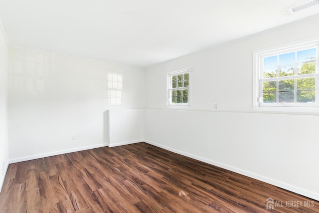 1682 Taylor Dr, North Brunswick, NJ 08902 - spare room with dark wood-style flooring and ornamental molding