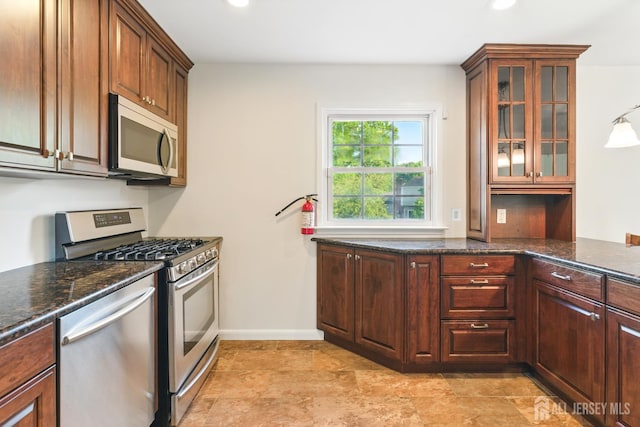 1682 Taylor Dr, North Brunswick, NJ 08902 - kitchen with appliances with stainless steel finishes, glass insert cabinets, recessed lighting, and dark stone counters