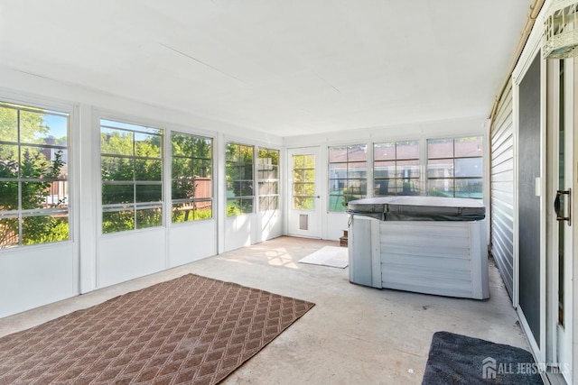 1682 Taylor Dr, North Brunswick, NJ 08902 - unfurnished sunroom featuring a hot tub and concrete flooring