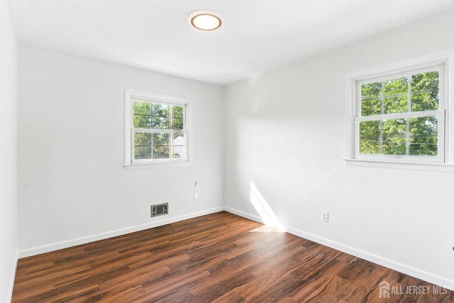 1682 Taylor Dr, North Brunswick, NJ 08902 - unfurnished room featuring dark wood finished floors