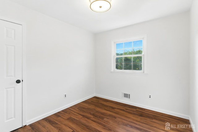 1682 Taylor Dr, North Brunswick, NJ 08902 - unfurnished room with baseboards and dark wood-style flooring