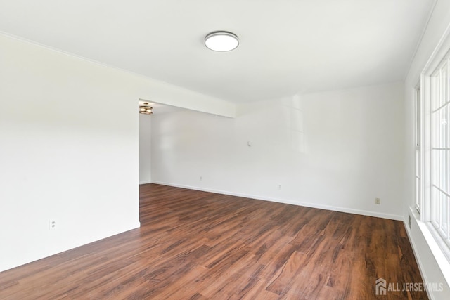 1682 Taylor Dr, North Brunswick, NJ 08902 - empty room featuring wood finished floors and ornamental molding