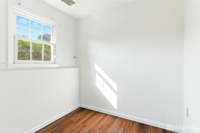 1682 Taylor Dr, North Brunswick, NJ 08902 - spare room featuring baseboards and dark wood-style floors