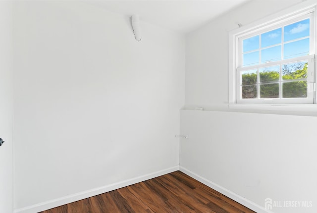 1682 Taylor Dr, North Brunswick, NJ 08902 - spare room with dark wood finished floors and baseboards