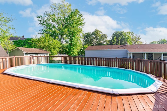 1682 Taylor Dr, North Brunswick, NJ 08902 - view of pool with a deck and an outbuilding