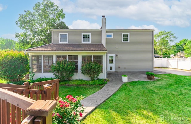 1682 Taylor Dr, North Brunswick, NJ 08902 - view of front of house with a sunroom and a patio