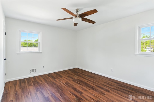 1682 Taylor Dr, North Brunswick, NJ 08902 - spare room featuring dark wood-style flooring and a ceiling fan