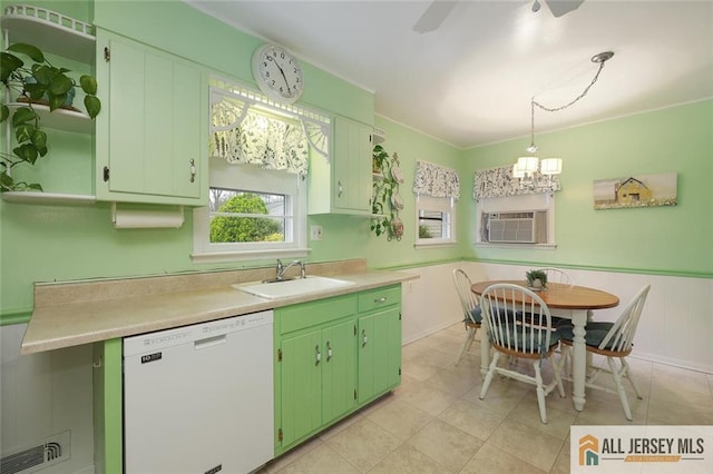 kitchen with dishwasher, a sink, light countertops, wainscoting, and cooling unit