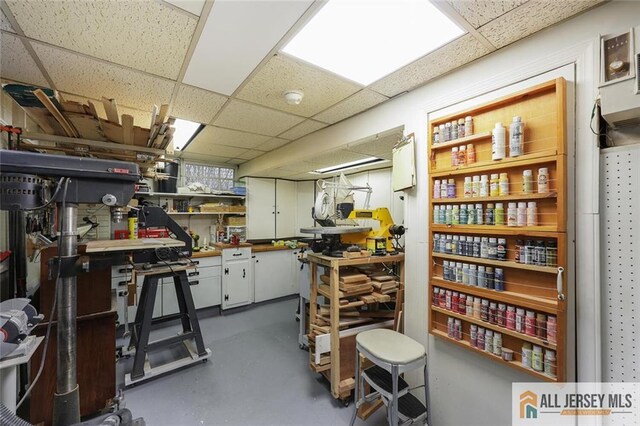 435 2nd St, Middlesex, NJ 08846 - below grade area with a workshop area and a paneled ceiling