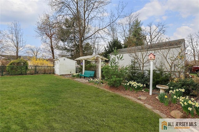 view of yard featuring a shed and an outdoor structure