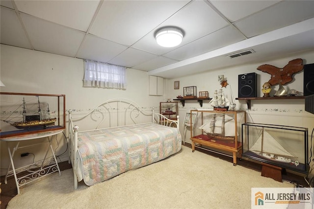 bedroom featuring a paneled ceiling