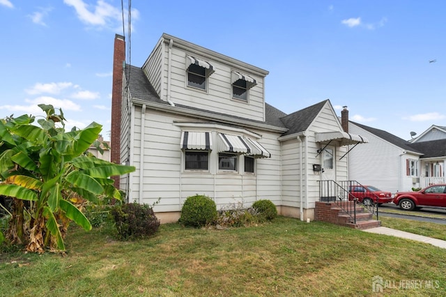 bungalow with a front yard