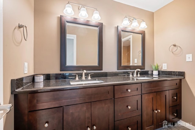 bathroom featuring double vanity and a sink