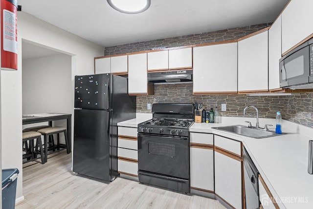 907 Meadow Ct, Helmetta, NJ 08828 - kitchen featuring black appliances, light countertops, white cabinetry, and tasteful backsplash