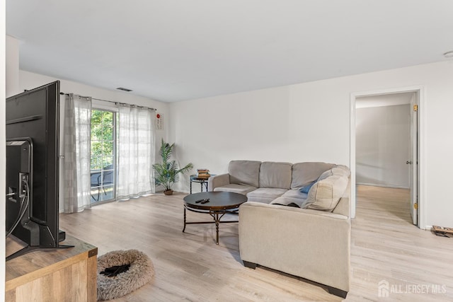 907 Meadow Ct, Helmetta, NJ 08828 - living area featuring light wood-style flooring and baseboards