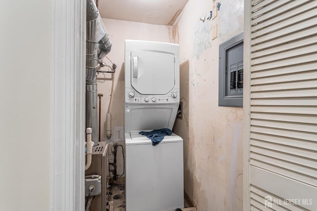 907 Meadow Ct, Helmetta, NJ 08828 - washroom featuring stacked washer / dryer and electric panel