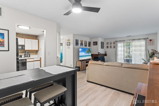 907 Meadow Ct, Helmetta, NJ 08828 - living area featuring light wood-style flooring and a ceiling fan