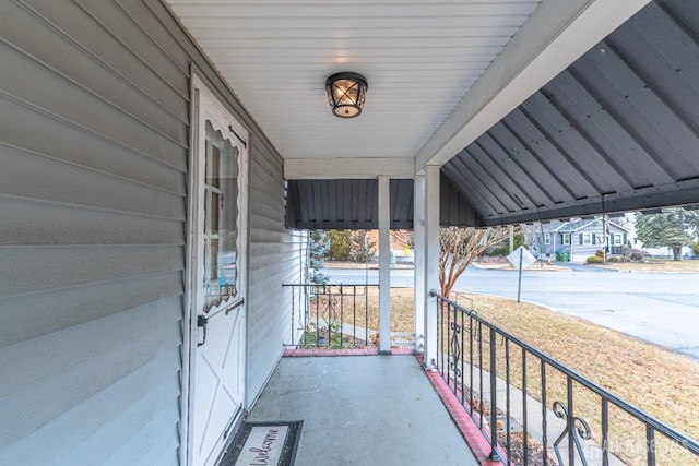 view of patio featuring a porch and a carport