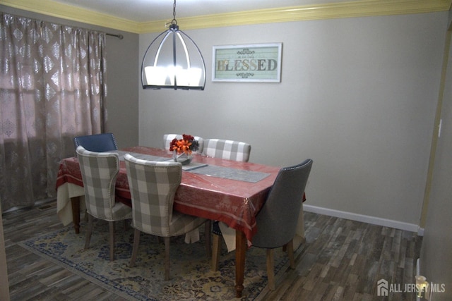 22 Delaney Ct, South Plainfield, NJ 07080 - dining area featuring wood finished floors, crown molding, baseboards, and a chandelier