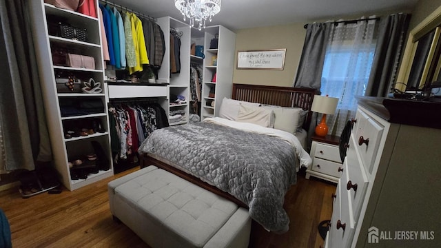 22 Delaney Ct, South Plainfield, NJ 07080 - bedroom featuring a chandelier and wood finished floors