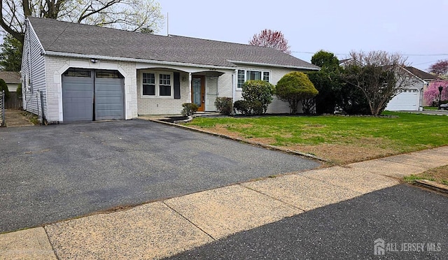 22 Delaney Ct, South Plainfield, NJ 07080 - ranch-style home with a garage, a front lawn, brick siding, and asphalt driveway