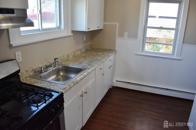 30 John St, South River, NJ 08882 - kitchen with range with gas stovetop, a baseboard heating unit, range hood, a sink, and white cabinetry