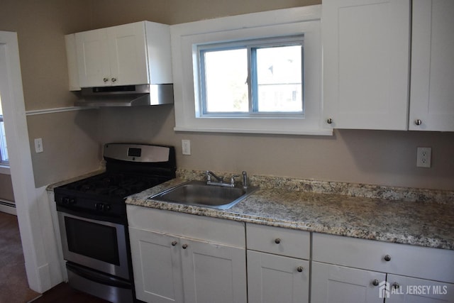 30 John St, South River, NJ 08882 - kitchen featuring a baseboard heating unit, a sink, under cabinet range hood, white cabinetry, and gas stove