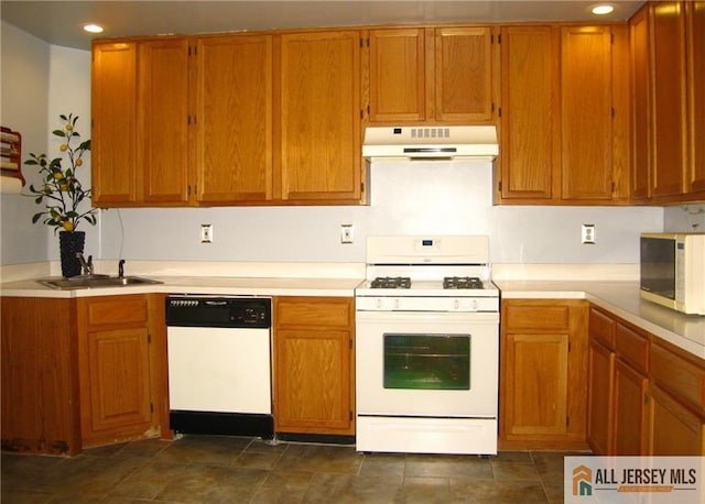 kitchen with sink and white appliances