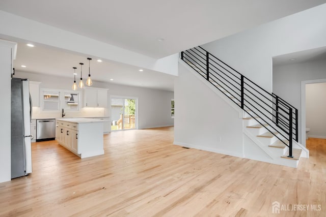 705 Plainfield Ave, Piscataway, NJ 08854 - unfurnished living room featuring light wood-style flooring, recessed lighting, and stairway