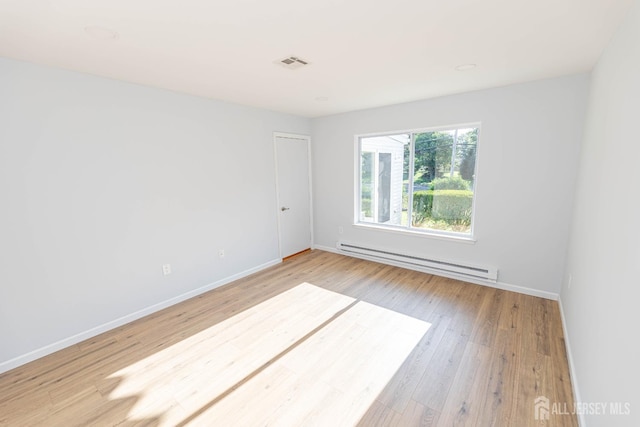 372-B Duranta Plz, Monroe, NJ 08831 - empty room with baseboard heating and light wood-type flooring