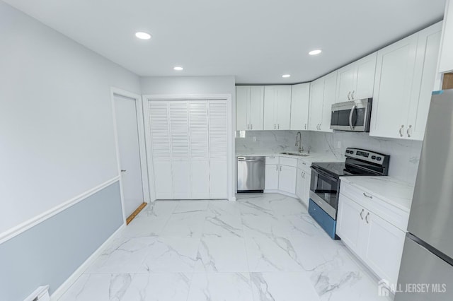 372-B Duranta Plz, Monroe, NJ 08831 - kitchen featuring appliances with stainless steel finishes, recessed lighting, white cabinets, light stone countertops, and light marble finish flooring