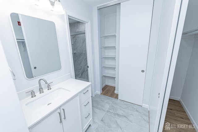 372-B Duranta Plz, Monroe, NJ 08831 - full bath with a spacious closet, vanity, and wood finished floors