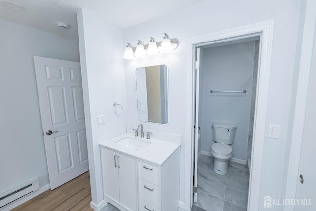 372-B Duranta Plz, Monroe, NJ 08831 - bathroom with a baseboard heating unit, vanity, and wood finished floors